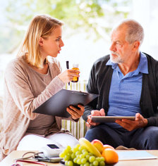 caregiver discussing about medication to senior man
